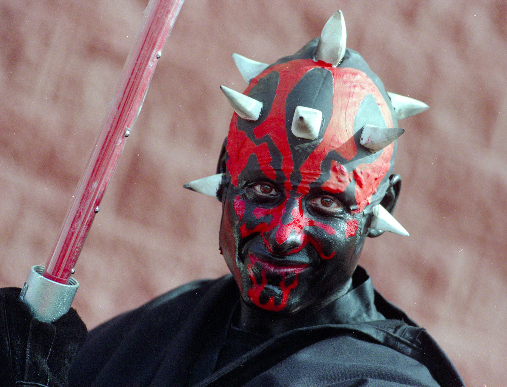 Logan Cruz wears an elaborate costume of Star Wars character Darth Maul